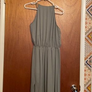 Backless shark grey halter dress with thigh high slit on the left.
